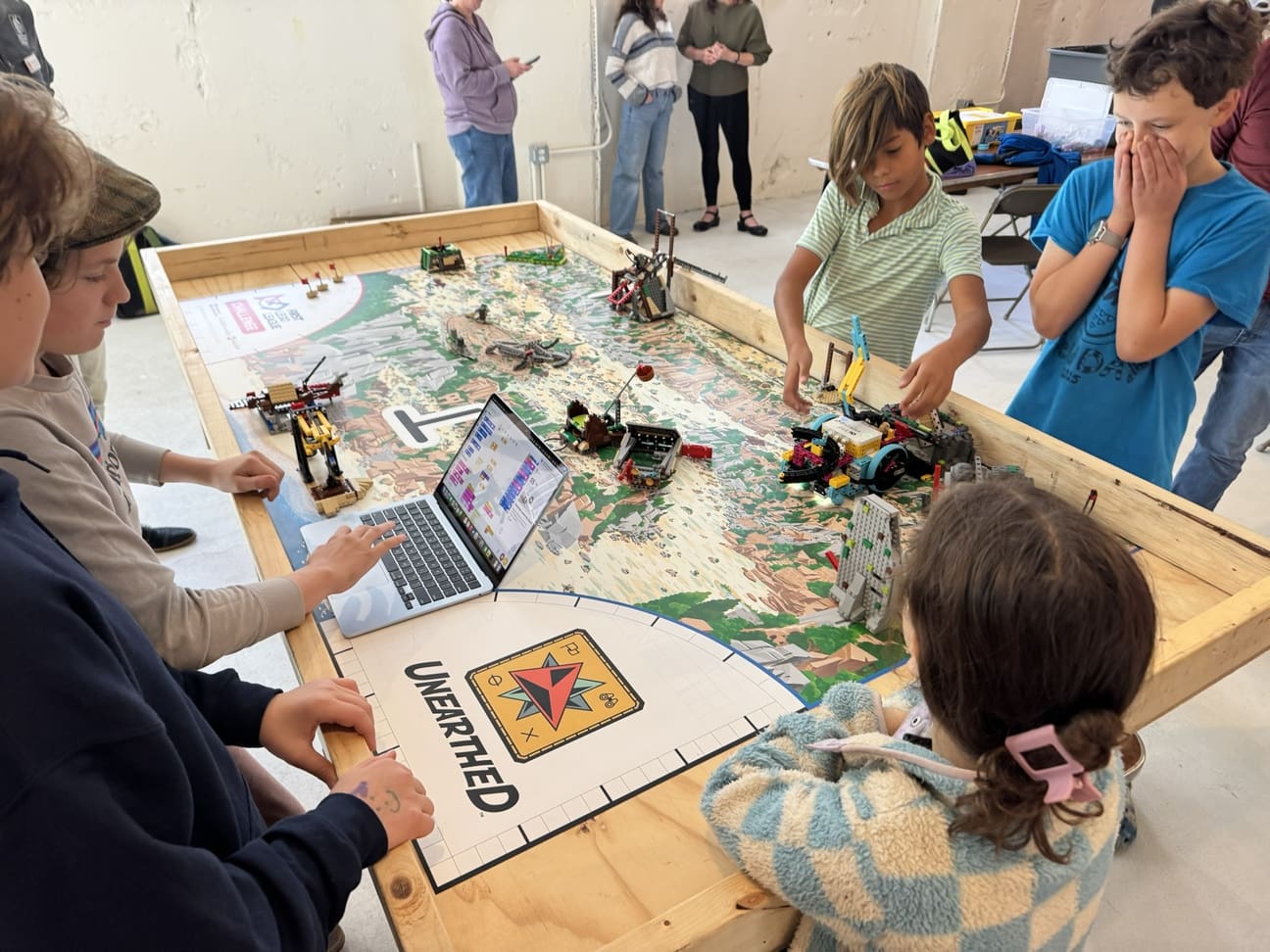 FLL team testing their robot on the challenge table at Robo Jam 2