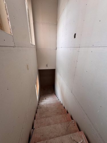 Stairwell with drywall (Jan 2026)
